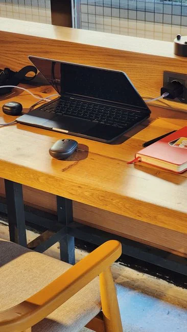 Colleagues engage in a contemporary office environment, combining technology with workplace cleanliness.